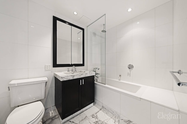 333 Rector Pl Unit 805, New York City, NY 10280 - full bath featuring tile walls, marble finish floors, toilet, vanity, and tiled shower / bath