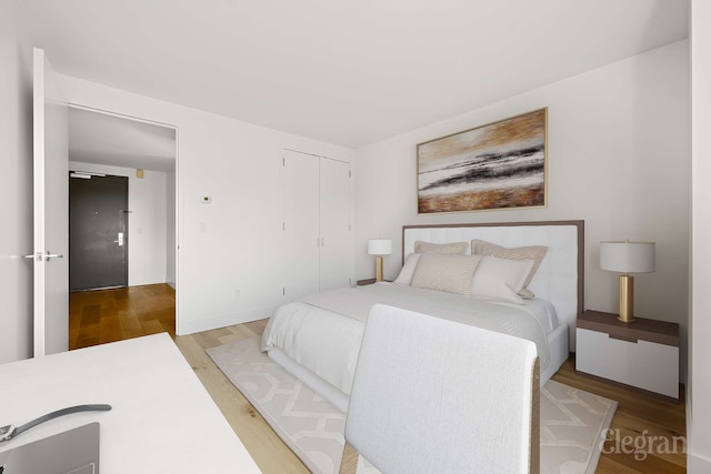 333 Rector Pl Unit 805, New York City, NY 10280 - bedroom featuring wood finished floors, a closet, and baseboards