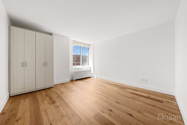 333 Rector Pl Unit 805, New York City, NY 10280 - unfurnished bedroom featuring light wood-style flooring and baseboards