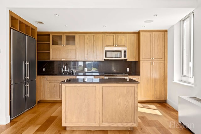 333 Rector Pl Unit 805, New York City, NY 10280 - kitchen with appliances with stainless steel finishes, a sink, open shelves, light wood-type flooring, and dark countertops