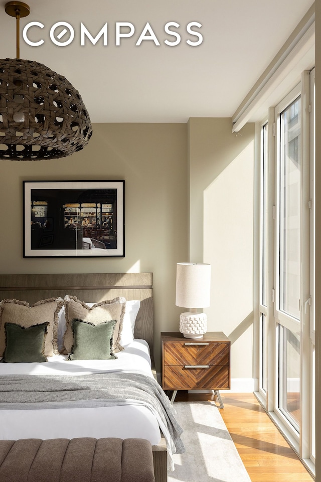 bedroom with wood finished floors