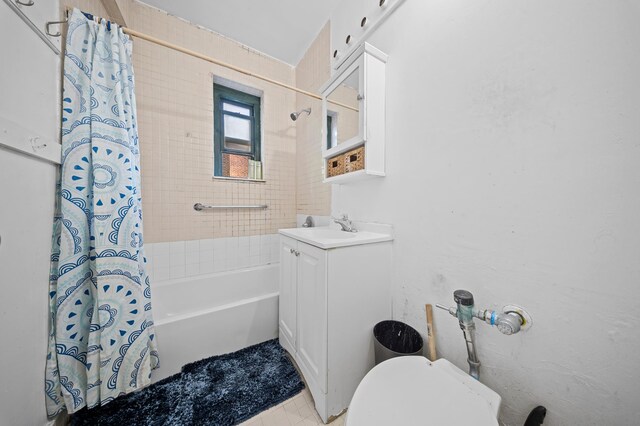 bathroom with vanity, tile patterned floors, shower / bath combo, and toilet