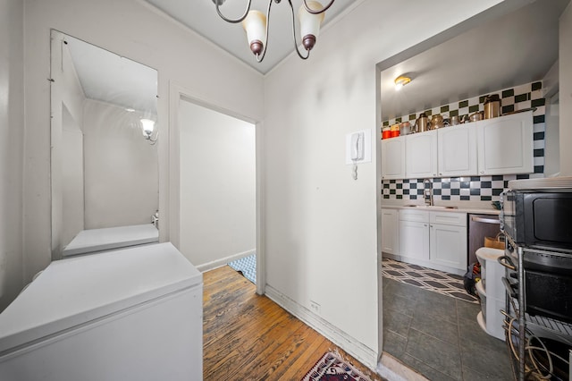 interior space with a sink and dark wood-style flooring