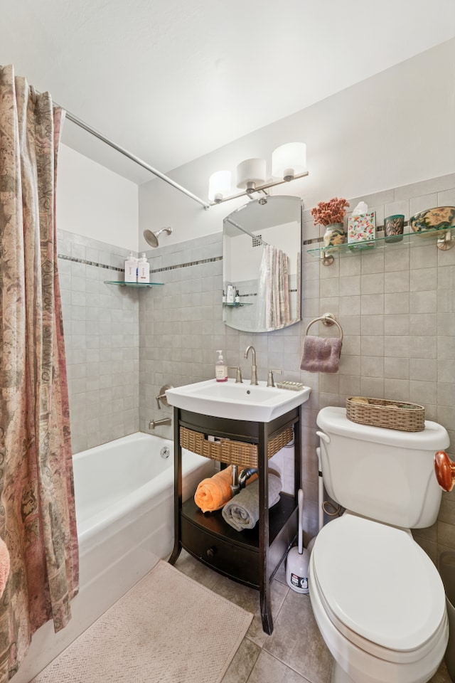 bathroom with tile walls, tile patterned floors, toilet, and shower / tub combo
