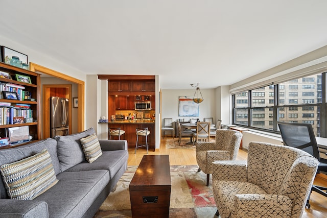 living area featuring light wood finished floors