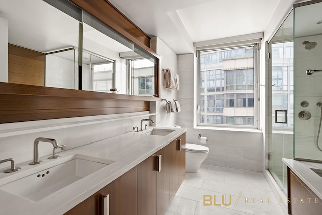 60 Riverside Blvd Unit 1502, New York City, NY 10069 - full bath with a shower stall, double vanity, toilet, and tile patterned floors