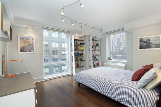 bedroom featuring dark wood-style floors