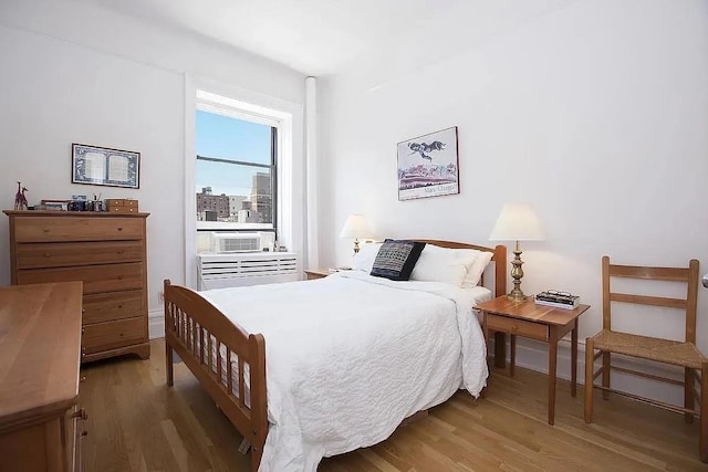 bedroom featuring wood finished floors