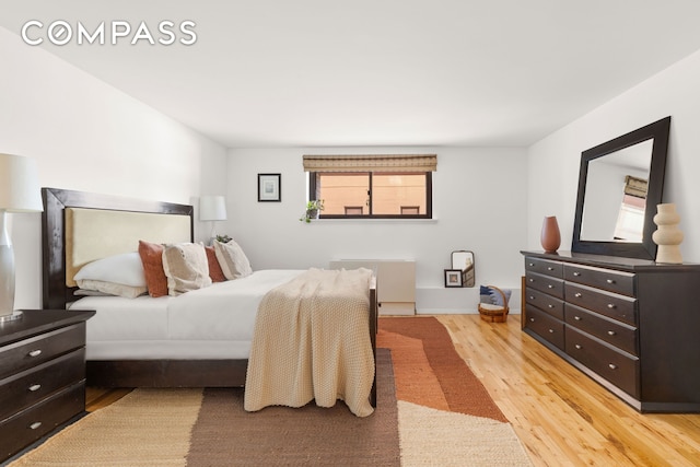 28 Old Fulton St Unit Thn, New York City, NY 11201 - bedroom featuring light wood-type flooring and radiator