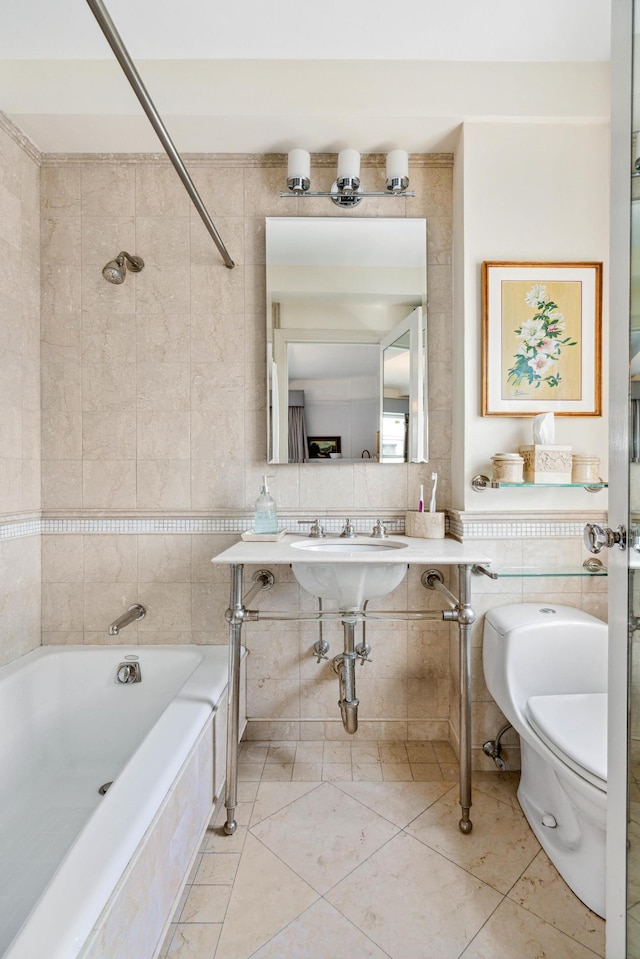 bathroom featuring tile patterned flooring, tiled shower / bath combo, toilet, and tile walls