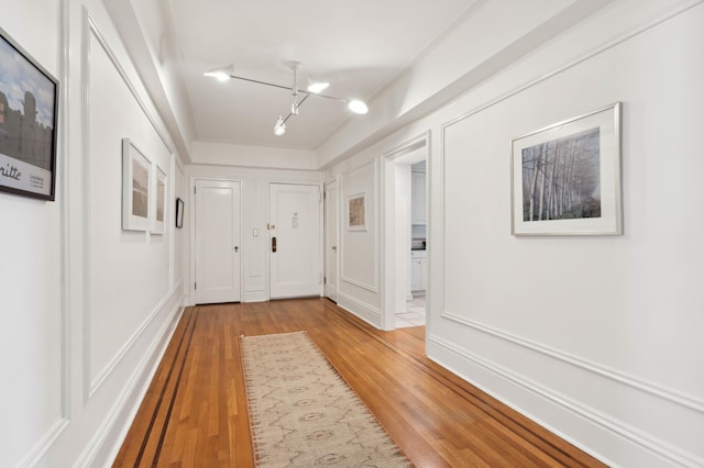 doorway to outside with light wood-style floors