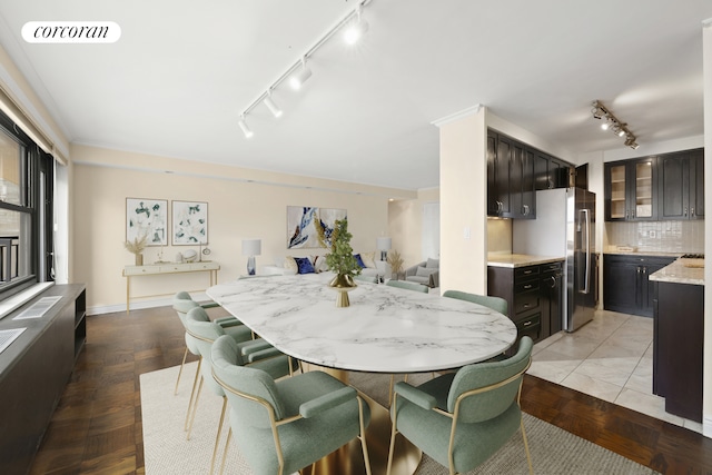 dining room with rail lighting and visible vents
