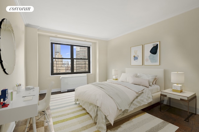 bedroom featuring crown molding, baseboards, visible vents, and radiator