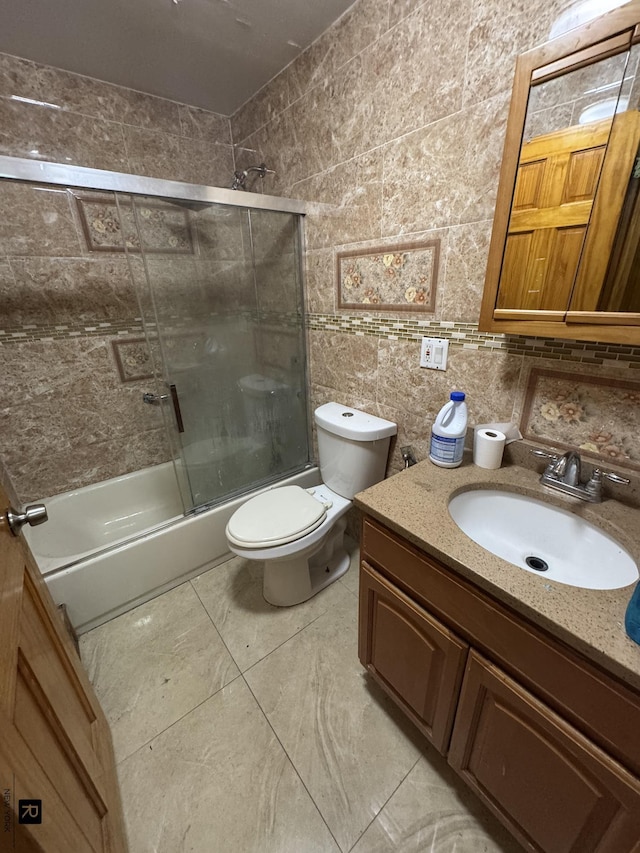 1264 E 73rd St, New York City, NY 11234 - full bathroom featuring tile walls, vanity, toilet, enclosed tub / shower combo, and tasteful backsplash