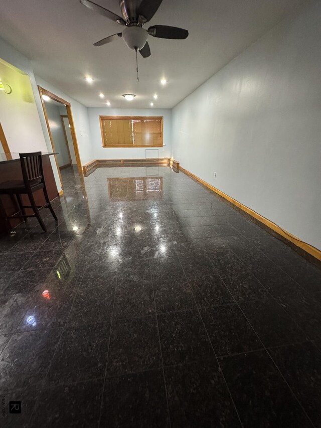 1264 E 73rd St, New York City, NY 11234 - unfurnished living room featuring baseboards, granite floors, ceiling fan, and recessed lighting