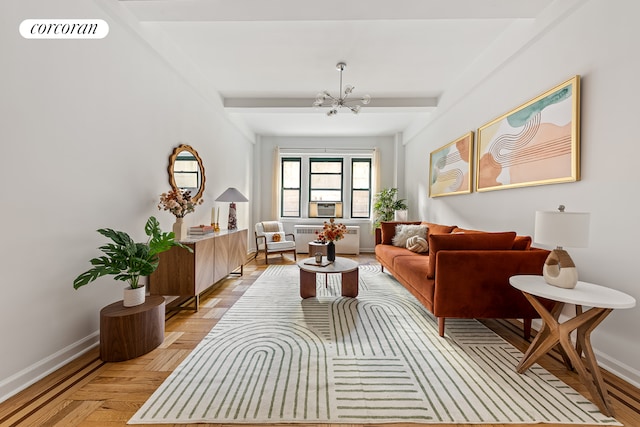 sitting room featuring radiator heating unit, a chandelier, baseboards, and beamed ceiling