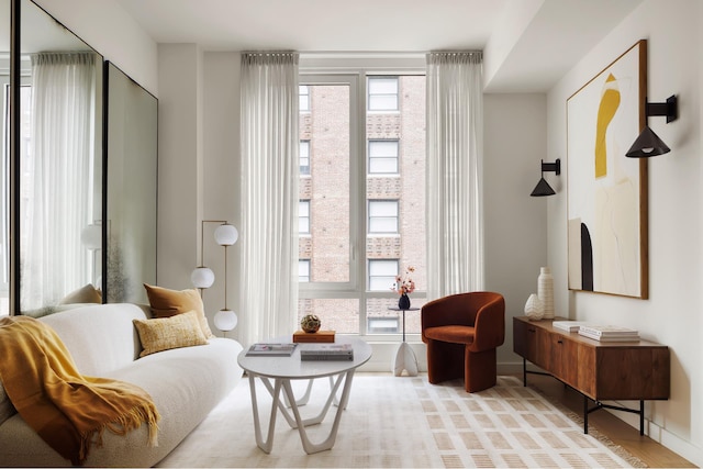 135 E 47th St Unit 20B, New York City, NY 10017 - living area featuring wood finished floors and baseboards