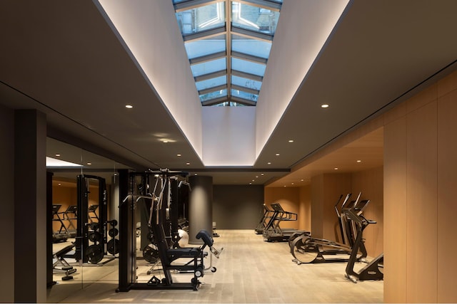 135 E 47th St Unit 20B, New York City, NY 10017 - exercise room with a towering ceiling, a skylight, and plenty of natural light