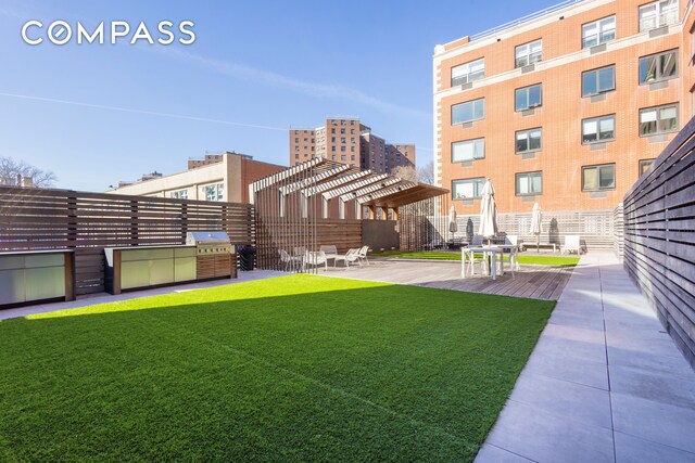 1330 5th Ave Unit 6C, New York City, NY 10026 - view of green lawn with a pergola