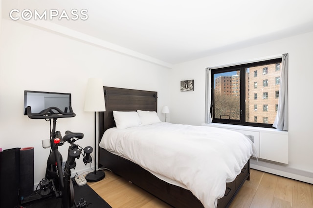 bedroom featuring light wood-style floors