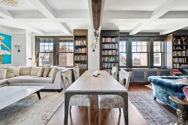 interior space with coffered ceiling, a wealth of natural light, and hardwood / wood-style flooring