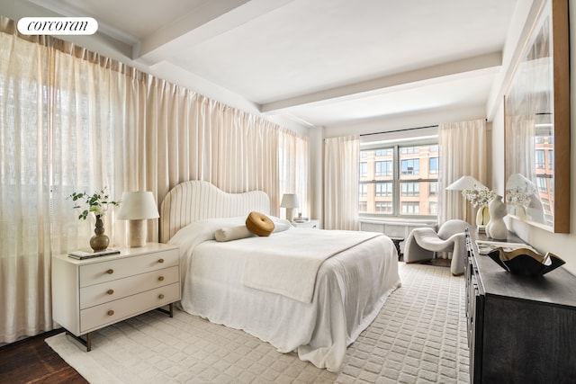 400 E 52nd St Unit 12Ff, New York City, NY 10022 - bedroom with beam ceiling and light wood-style floors