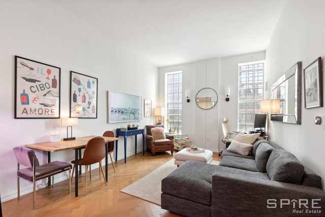 living room featuring baseboards and a wealth of natural light