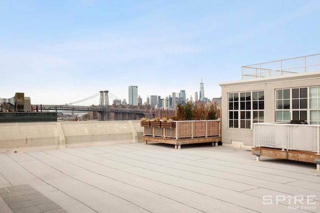 wooden terrace featuring a view of city