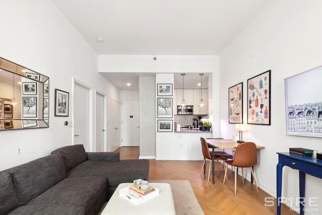 living room featuring baseboards