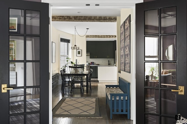 interior space with hardwood / wood-style flooring and a notable chandelier