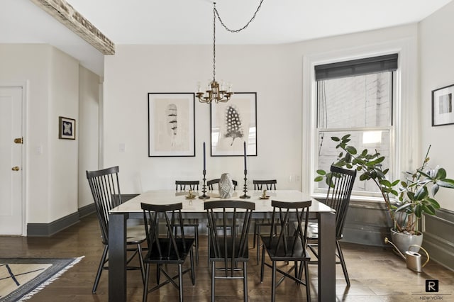 dining room with baseboards, dark wood-style flooring, and a chandelier
