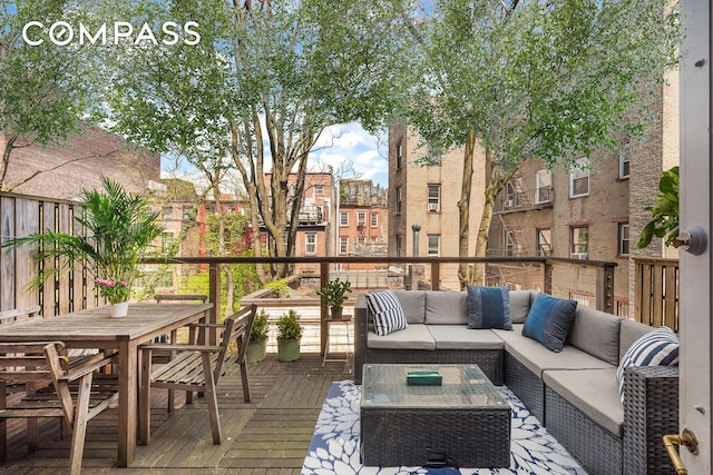 wooden deck featuring outdoor dining area and outdoor lounge area