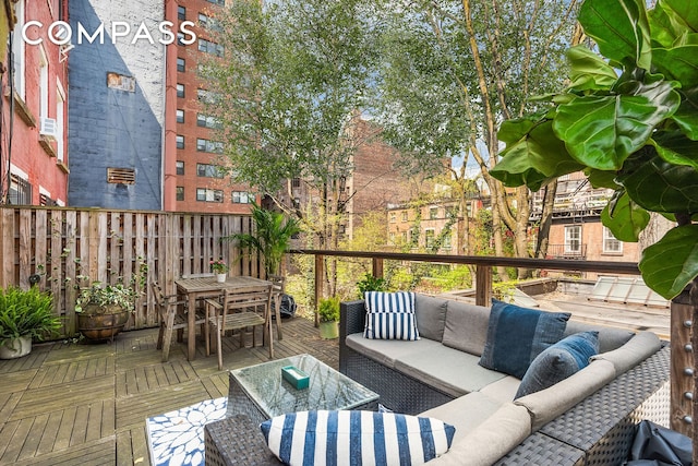 view of wooden balcony with outdoor lounge area and a wooden deck