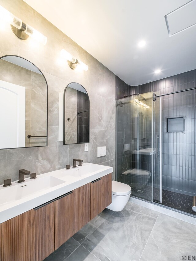 636 Lorimer St Unit 2, New York City, NY 11211 - full bath with toilet, tile walls, double vanity, a shower stall, and marble finish floors