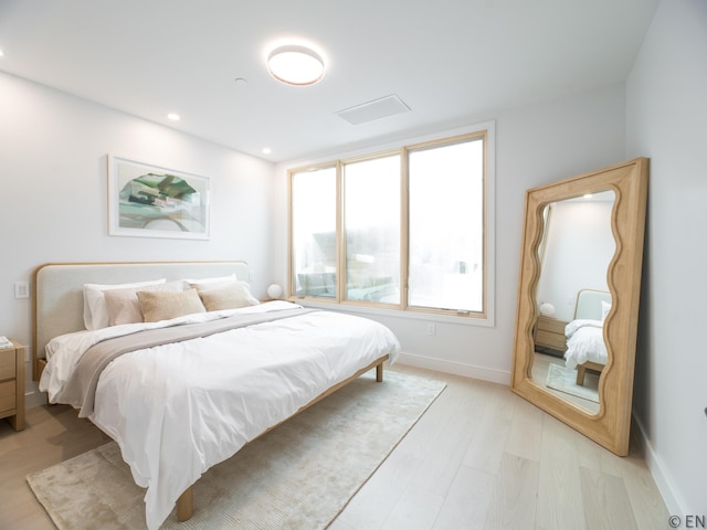 bedroom featuring recessed lighting, baseboards, and light wood finished floors