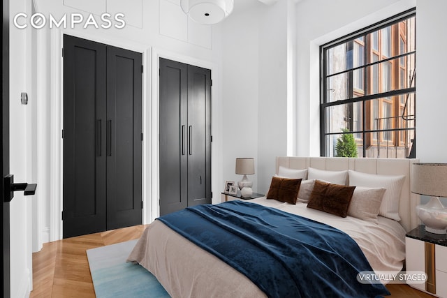 bedroom featuring multiple windows