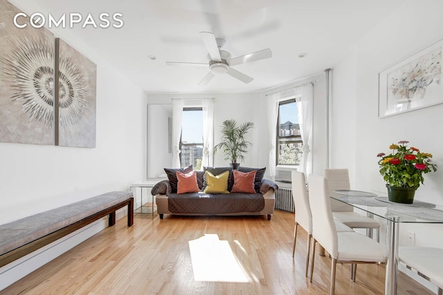 1878 Adam Clayton Powell Jr Blvd Unit 52, New York City, NY 10026 - living room featuring radiator, light wood-style flooring, and ceiling fan