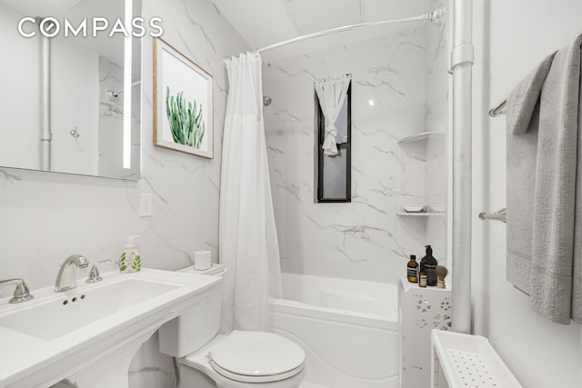 full bathroom featuring a sink, toilet, and shower / tub combo