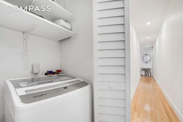 clothes washing area with washer / dryer, recessed lighting, baseboards, and light wood-type flooring