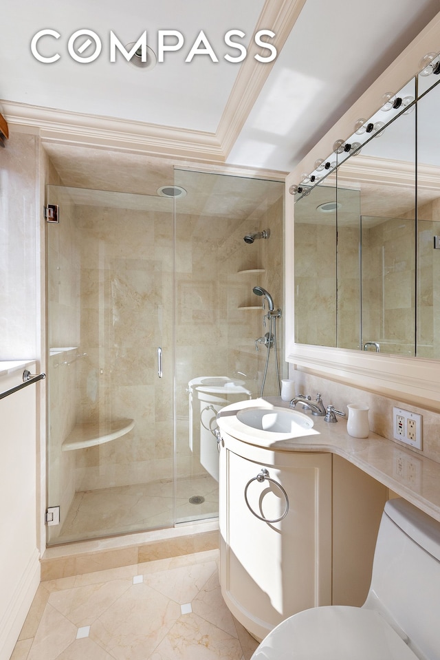 full bathroom with vanity, ornamental molding, marble finish floor, toilet, and a shower stall