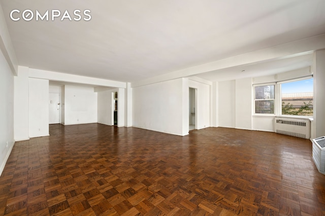 1025 5th Ave Unit 7As, New York City, NY 10028 - unfurnished living room with radiator and baseboards