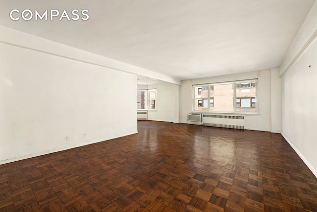 1025 5th Ave Unit 7As, New York City, NY 10028 - unfurnished living room with radiator and baseboards