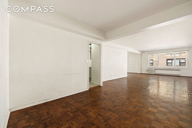 1025 5th Ave Unit 7As, New York City, NY 10028 - unfurnished living room with radiator heating unit and baseboards