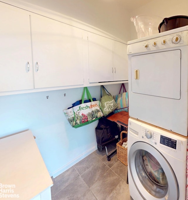 188 W 135th St Unit 5W, New York City, NY 10030 - washroom with estacked washer and dryer and cabinet space