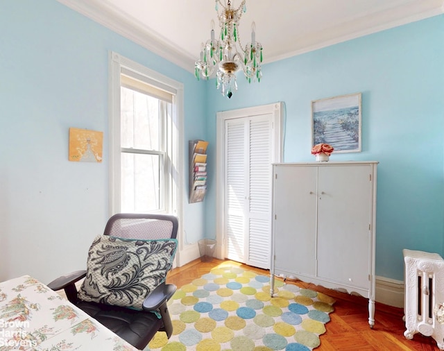 188 W 135th St Unit 5W, New York City, NY 10030 - bedroom with a closet, ornamental molding, baseboards, and a chandelier