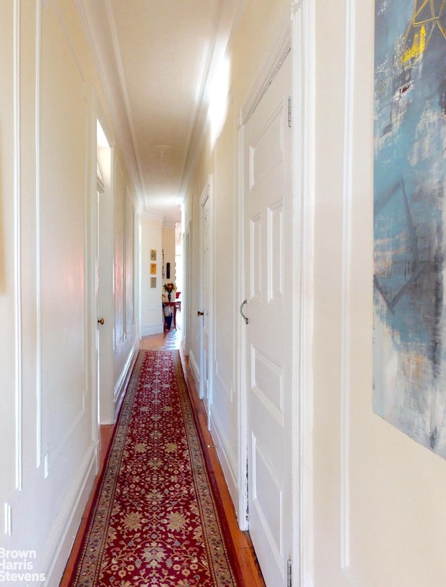 188 W 135th St Unit 5W, New York City, NY 10030 - hallway featuring crown molding and light wood-type flooring