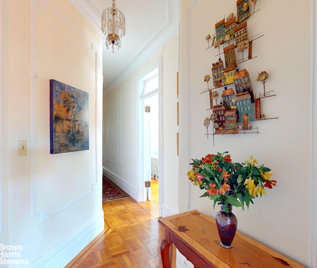 188 W 135th St Unit 5W, New York City, NY 10030 - hallway featuring ornamental molding and a chandelier