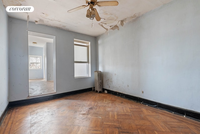 125 Stryker St, New York City, NY 11223 - empty room with radiator heating unit and a ceiling fan
