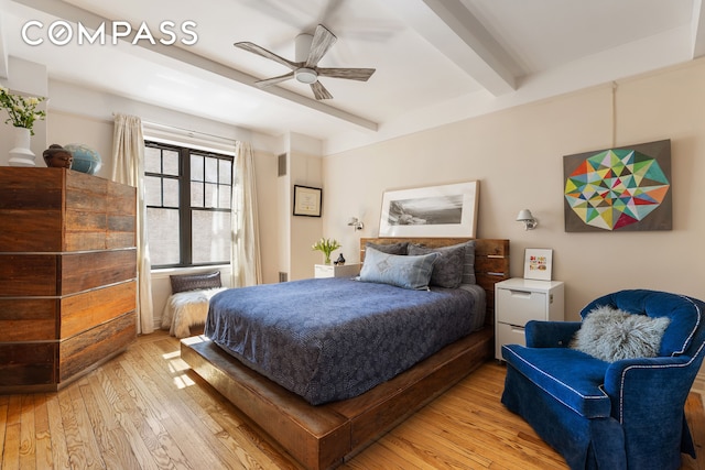 bedroom featuring beamed ceiling, visible vents, ceiling fan, and light wood-style floors