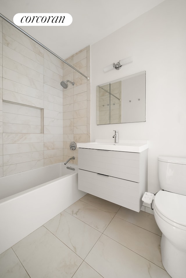 bathroom featuring vanity, toilet,  shower combination, and marble finish floor